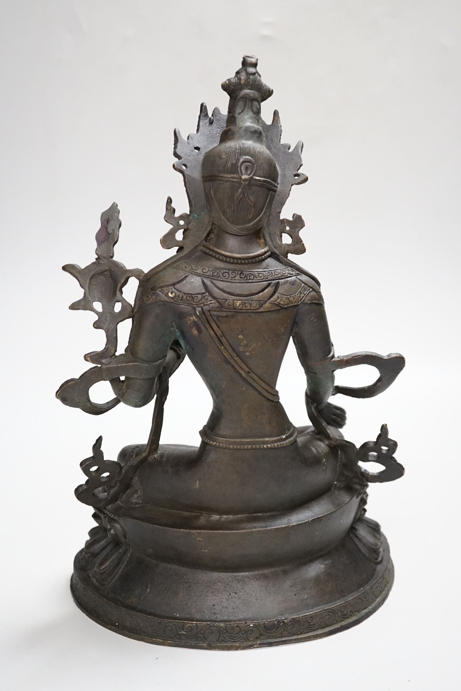 A Buddhist metal figure of ‘Green Tara’, 32cm high